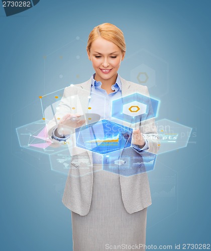 Image of smiling businesswoman working with virtual screen