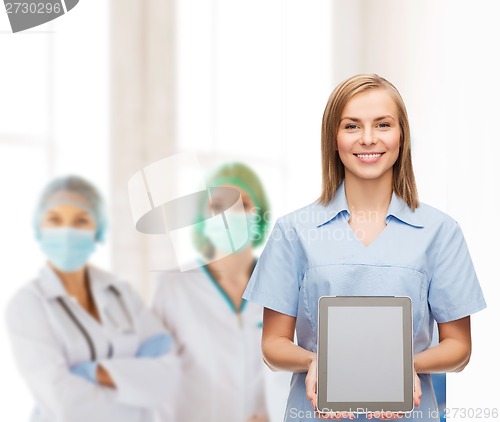 Image of smiling female doctor or nurse with tablet pc