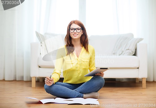 Image of student with tablet pc computer and notebooks