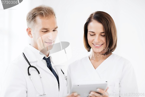 Image of two doctors looking at tablet pc