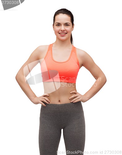 Image of smiling teenage girl in sportswear