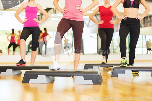 Image of close up of women legs steping on step platform