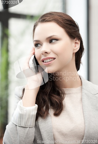 Image of businesswoman with cell phone calling