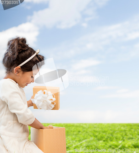 Image of happy child girl with gift box