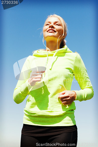 Image of woman doing running outdoors