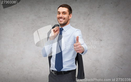 Image of handsome buisnessman with jacket over shoulder