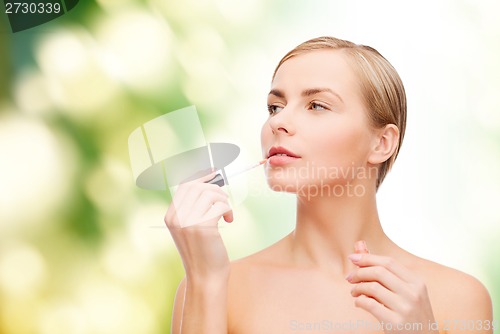 Image of beautiful woman with lipgloss