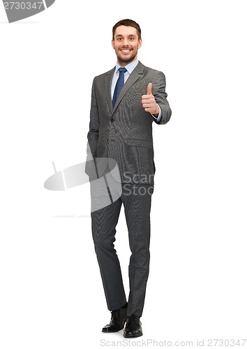 Image of handsome buisnessman showing thumbs up