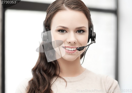 Image of friendly female helpline operator