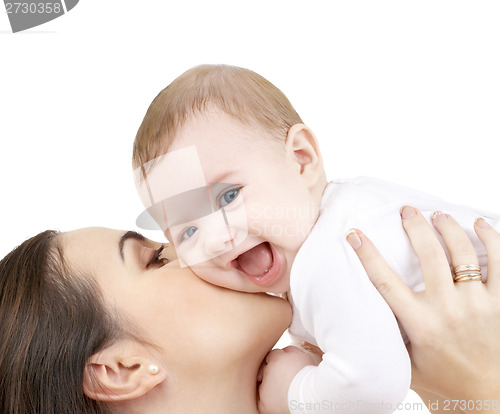 Image of laughing baby playing with mother