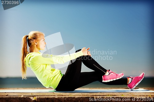 Image of woman doing sports outdoors