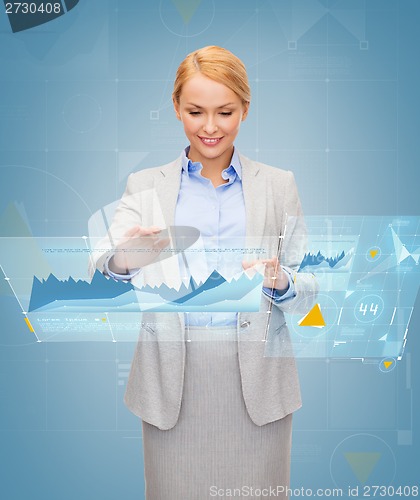 Image of smiling businesswoman working with virtual screen