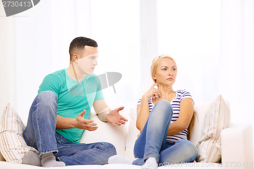 Image of unhappy couple having argument at home