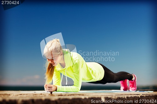 Image of woman doing sports outdoors