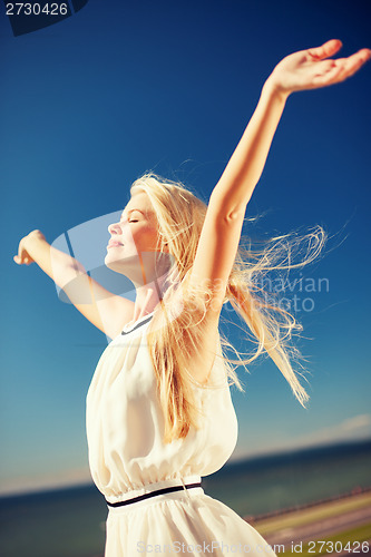 Image of beautiful woman enjoying summer outdoors