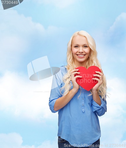 Image of smiling woman with red heart