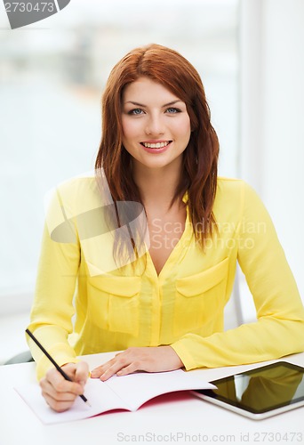 Image of student with tablet pc computer and notebook