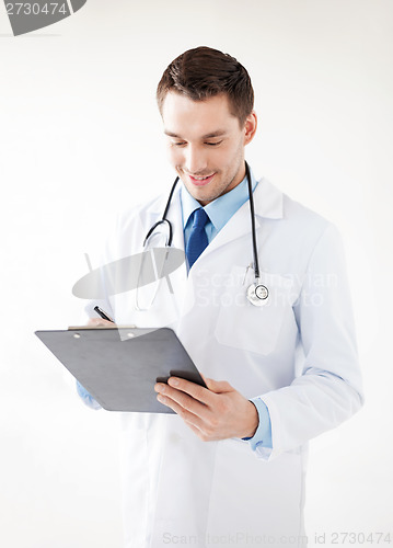 Image of male doctor writing prescription