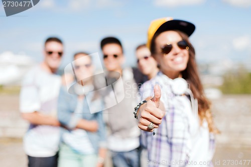 Image of close up of female hand showing thumbs up