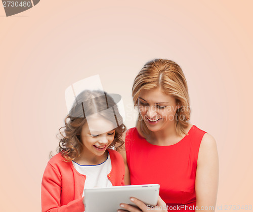 Image of mother and daughter with tablet pc computer