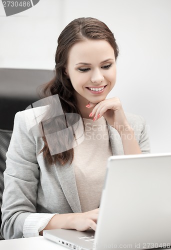 Image of businesswoman with laptop