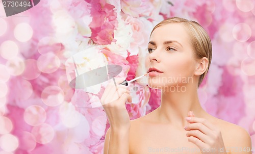 Image of beautiful woman with lipgloss