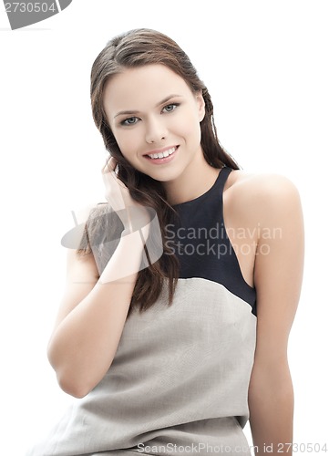 Image of happy and smiling young elegant womanl outdoors