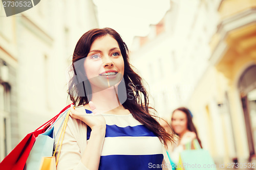 Image of woman with shopping bags in ctiy