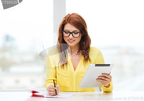 Image of student with tablet pc computer and notebook