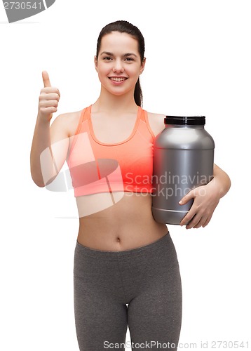 Image of teenage girl with jar of protein showing thumbs up