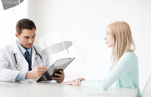 Image of doctor with patient in hospital