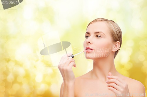 Image of beautiful woman with lipgloss