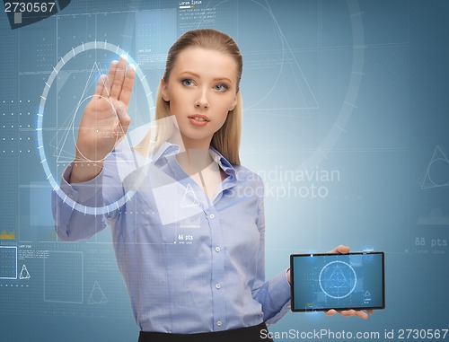 Image of smiling woman working with tablet pc
