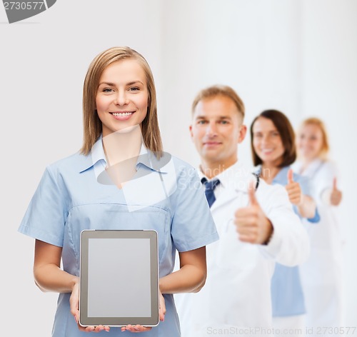 Image of smiling female doctor or nurse with tablet pc