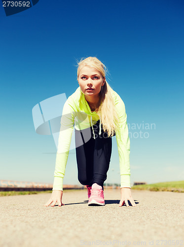 Image of woman doing running outdoors