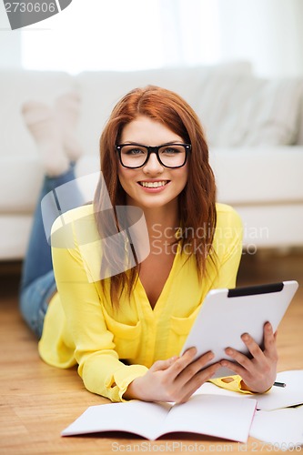 Image of student with tablet pc computer and notebooks