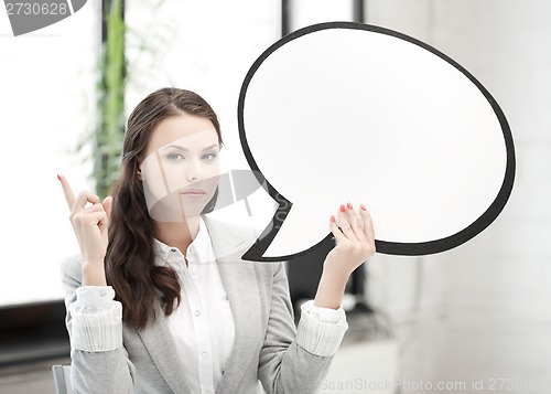 Image of businesswoman holding blank text bubble
