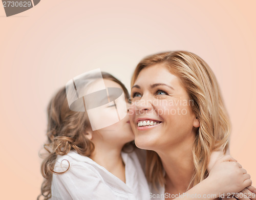 Image of smiling mother and daughter hugging