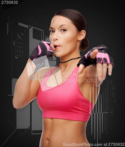 Image of asian personal trainer with whistle