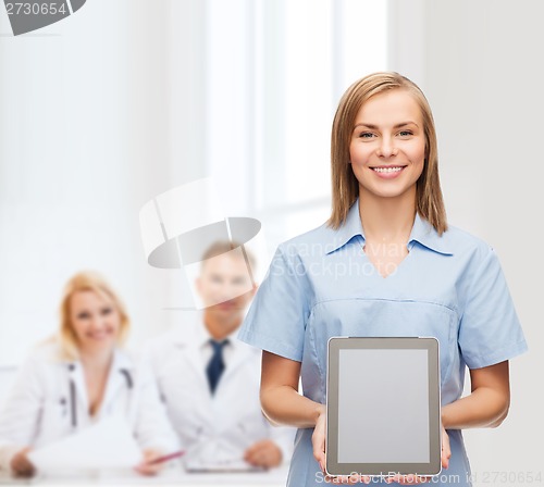 Image of smiling female doctor or nurse with tablet pc