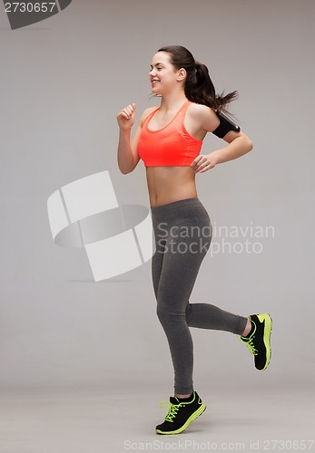 Image of sporty woman running or jumping