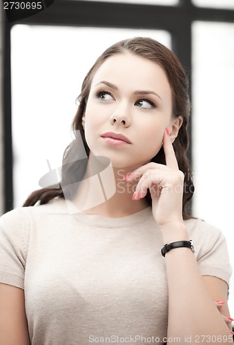 Image of calm and serious thinking woman