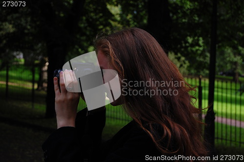 Image of Woman taking a photo