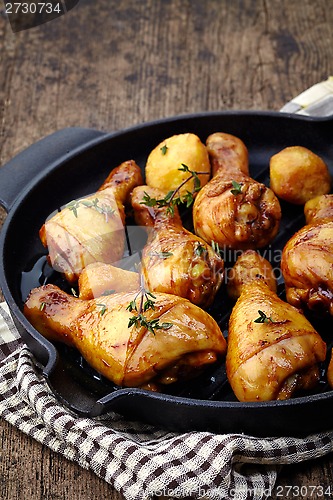 Image of Roasted chicken legs and potatoes