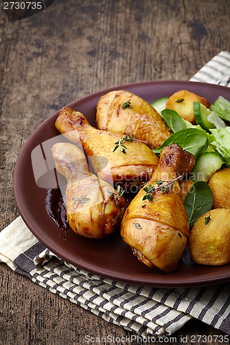 Image of Roasted chicken legs and potatoes