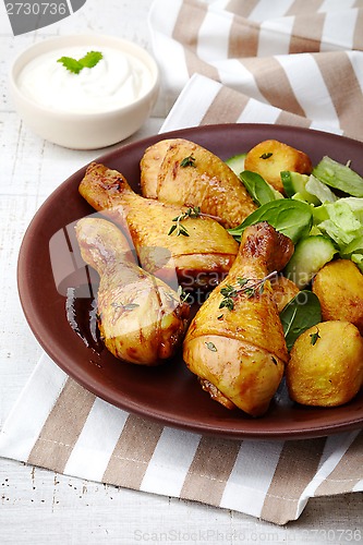 Image of Roasted chicken legs and potatoes