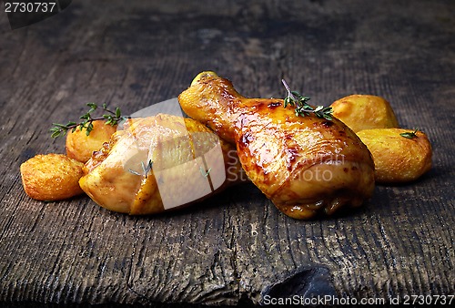 Image of Roasted chicken legs and potatoes