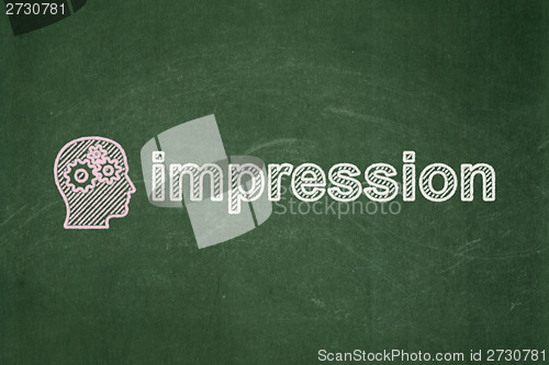 Image of Marketing concept: Head With Gears and Impression on chalkboard background