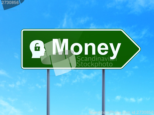 Image of Finance concept: Money and Head With Padlock on road sign background
