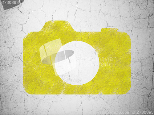 Image of Tourism concept: Photo Camera on wall background